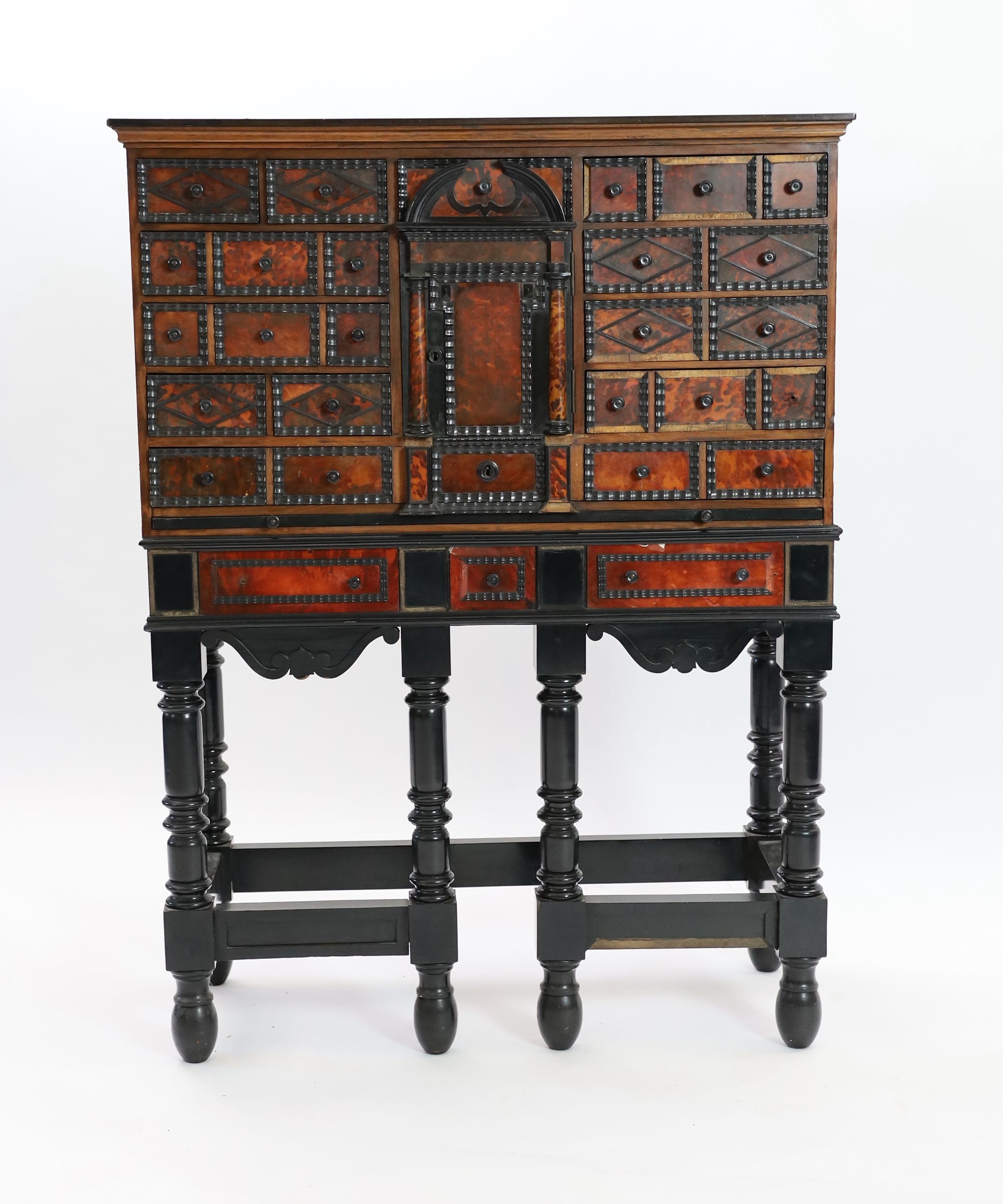 A 17th century Flemish style ebony and tortoiseshell cabinet on stand, width 99cm depth 42cm height 131cm